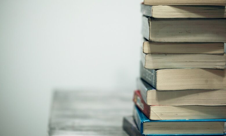 assorted books on wooden table