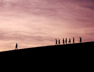 silhouette of people on hill