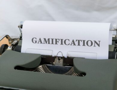 a close up of a typewriter with a paper that reads gamification