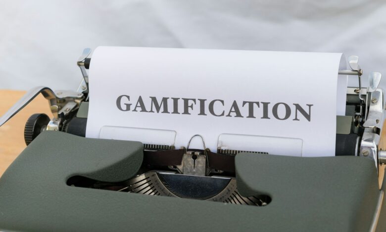 a close up of a typewriter with a paper that reads gamification