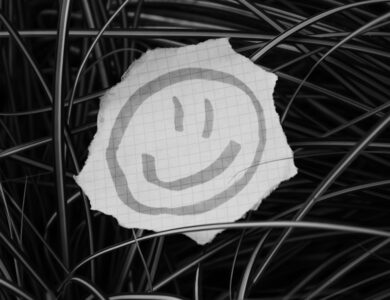 a piece of paper with a smiley face drawn on it