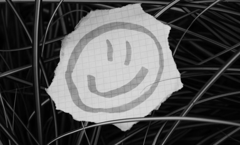 a piece of paper with a smiley face drawn on it