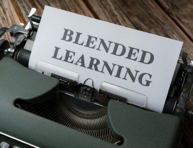 a close up of a typewriter with a sign that reads blended learning
