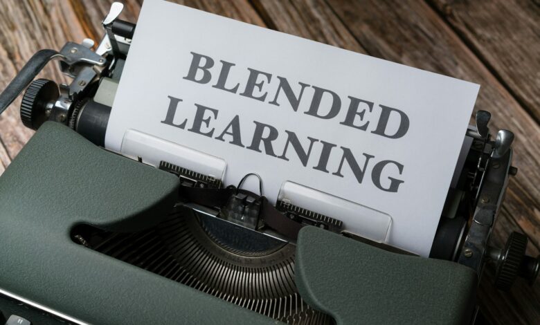 a close up of a typewriter with a sign that reads blended learning