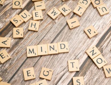scrabble tiles spelling out the word mind