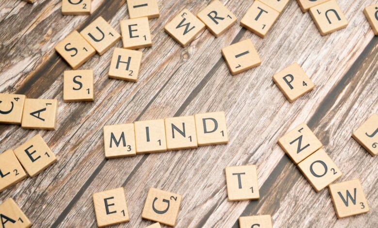 scrabble tiles spelling out the word mind