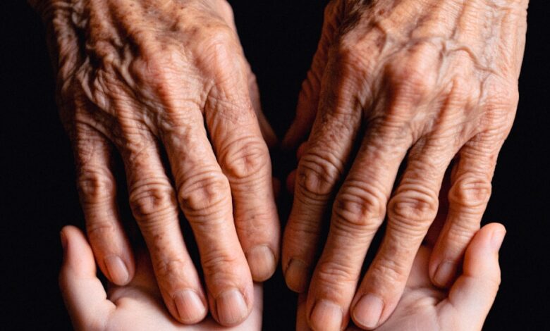 Old hands cradling the younger ones.