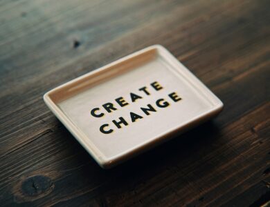 A white tray with the words create change written on it