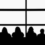 silhouette of people sitting on chair