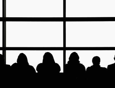 silhouette of people sitting on chair