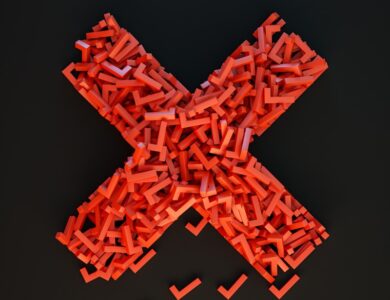 a cross made out of small pieces of red plastic