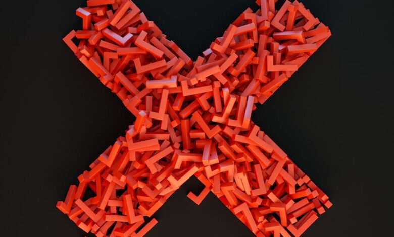 a cross made out of small pieces of red plastic